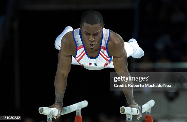 Toronto Panam Games 2015: Manrique Larduet from Cuba works in the parallel bars in Gymnastic Artistic. He ends in second place and gets the Silver...