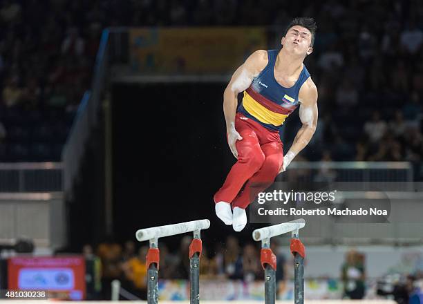 Toronto PanAm Games 2015: Jossimar Calvo Moreno from Colombia working in the parallel bars in the Gymnastic Artistic event. He goes to get the Gold...