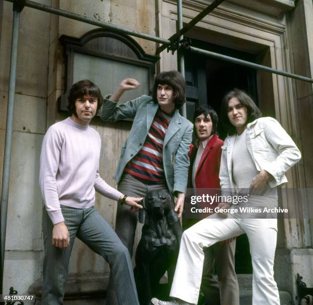 Portrait of English rock band The Kinks as they pose under scaffolding, London, England, 1978. Pictured are brothers Ray Davies and Dave Davies ,...