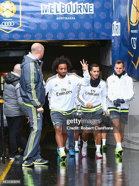 Marcelo of Real Madrid acknowledges fans as he arrives during a Real Madrid training session at Melbourne Cricket Ground on July 17, 2015 in...