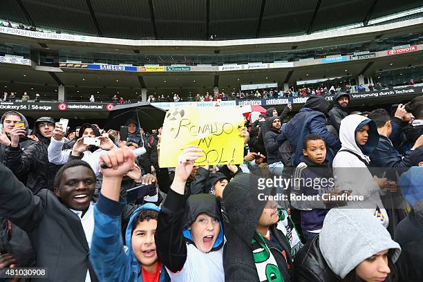 Fans cheer during a Real Madrid training session at Melbourne Cricket Ground on July 17, 2015 in Melbourne, Australia.