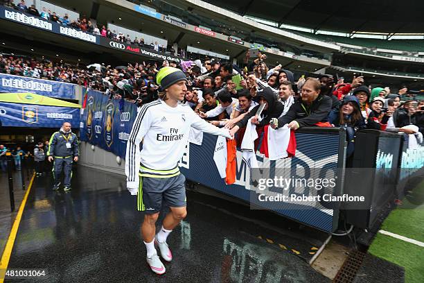 Luca Modric of Real Madrid acknowledges fans during a Real Madrid training session at Melbourne Cricket Ground on July 17, 2015 in Melbourne,...