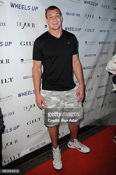 Player Rob Gronkowski attends his Dujour summer cover issue party hosted by Nicole Vecchiarelli, Bruce Webber and Jason Binn at Lavo on July 16, 2015...