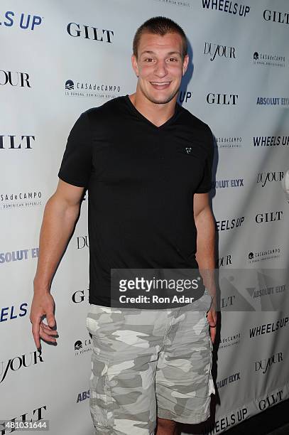 Player Rob Gronkowski attends his Dujour summer cover issue party hosted by Nicole Vecchiarelli, Bruce Webber and Jason Binn at Lavo on July 16, 2015...