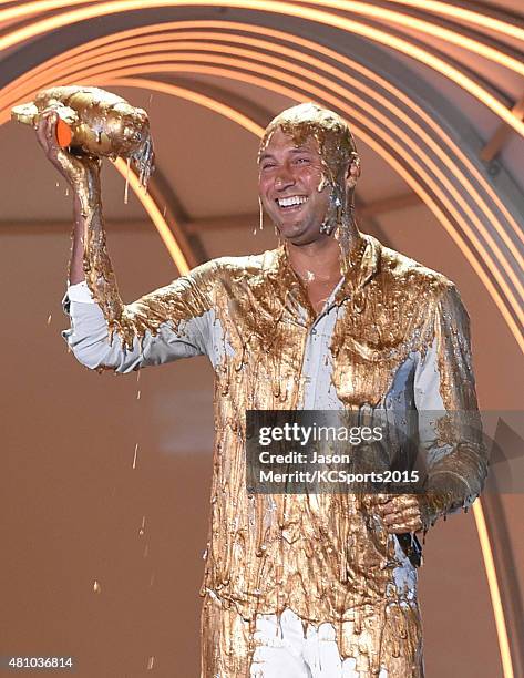 Legend Award recipient Derek Jeter gets covered in gold slime onstage at the Nickelodeon Kids' Choice Sports Awards 2015 at UCLA's Pauley Pavilion on...