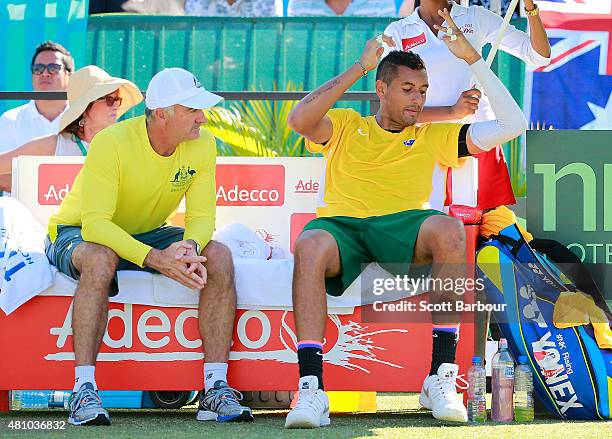 Nick Kyrgios of Australia reacts as Wally Masur, captain of Australia talks to him in his match against Aleksandr Nedovyesov of Kazakhstan during day...