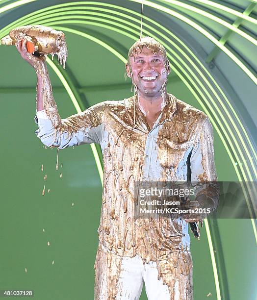 Legend Award recipient Derek Jeter gets covered in gold slime onstage at the Nickelodeon Kids' Choice Sports Awards 2015 at UCLA's Pauley Pavilion on...