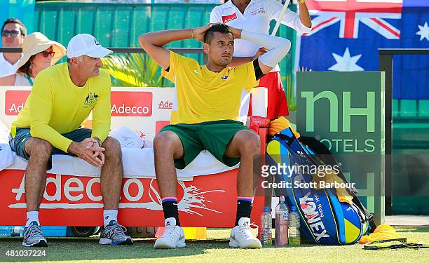 Nick Kyrgios of Australia reacts as Wally Masur, captain of Australia talks to him in his match against Aleksandr Nedovyesov of Kazakhstan during day...