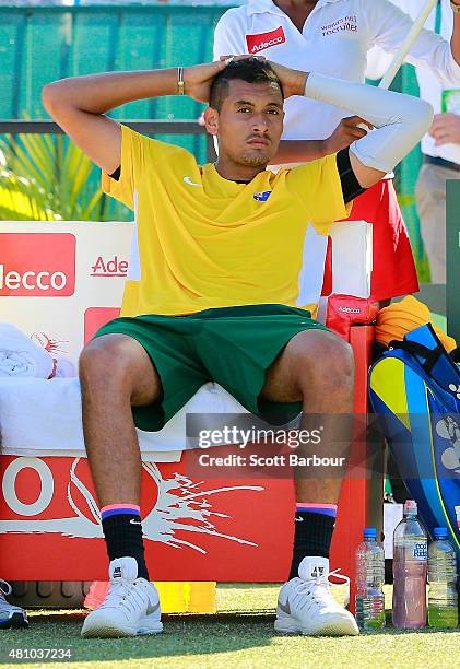 Nick Kyrgios of Australia looks on as he sits in his chair in between games in his match against Aleksandr Nedovyesov of Kazakhstan during day one of...