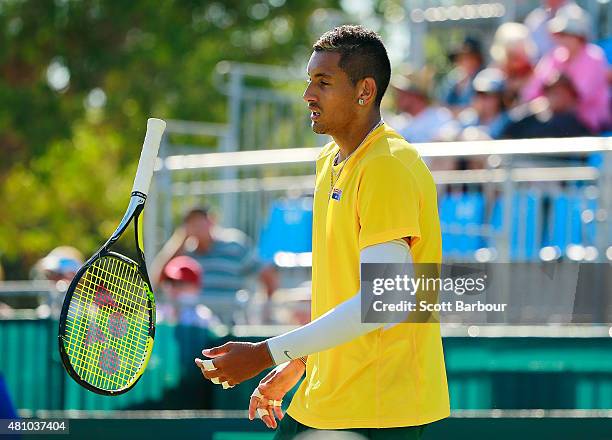 Nick Kyrgios of Australia throws his racquet as he loses a game against Aleksandr Nedovyesov of Kazakhstan during day one of the Davis Cup World...