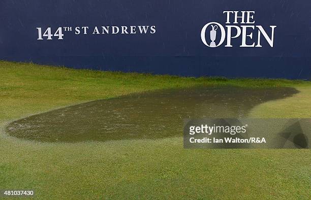 The course becomes flooded as rain falls prior to the second round of the 144th Open Championship at The Old Course on July 17, 2015 in St Andrews,...