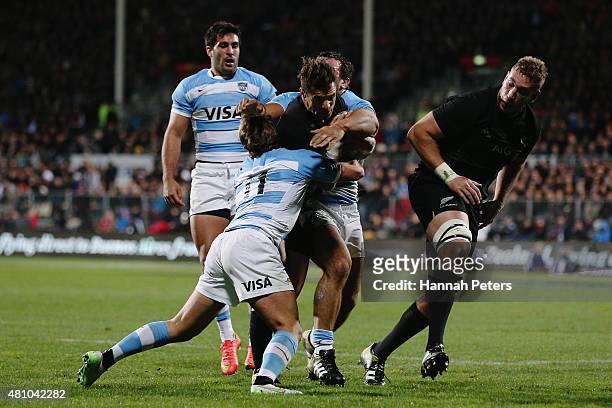 Daniel Carter of the New Zealand All Blacks makes a break during The Rugby Championship match between the New Zealand All Blacks and Argentina at AMI...