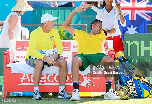 Nick Kyrgios of Australia reacts as Wally Masur, captain of Australia talks to him in his match against Aleksandr Nedovyesov of Kazakhstan during day...