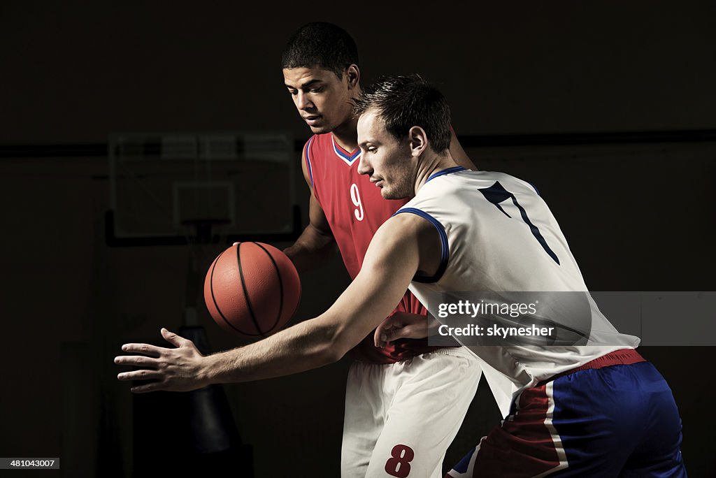 Men playing basketball.