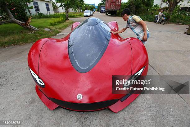View of the home-made electric car designed by Chen Yinxi in a glass factory owned by his father on July 17, 2015 in Haikou in south China's Hainan...