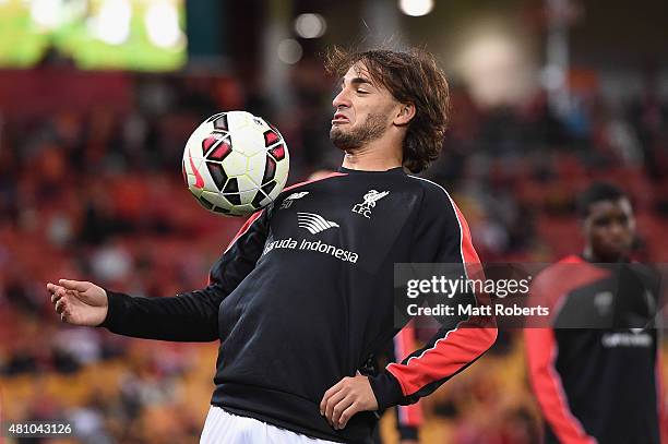 Lazar Markovic of Liverpool warms up on the field before the international friendly match between Brisbane Roar and Liverpool FC at Suncorp Stadium...