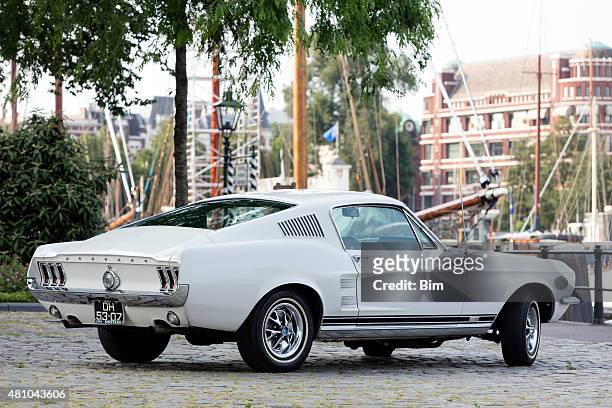 1967 ford mustang fastback in old yacht harbor in rotterdam - ford mustangs stock pictures, royalty-free photos & images