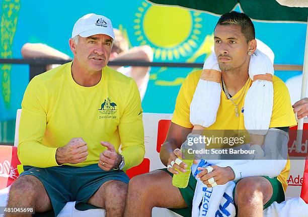 Nick Kyrgios of Australia reacts as Wally Masur, captain of Australia talks to him in his match against Aleksandr Nedovyesov of Kazakhstan during day...