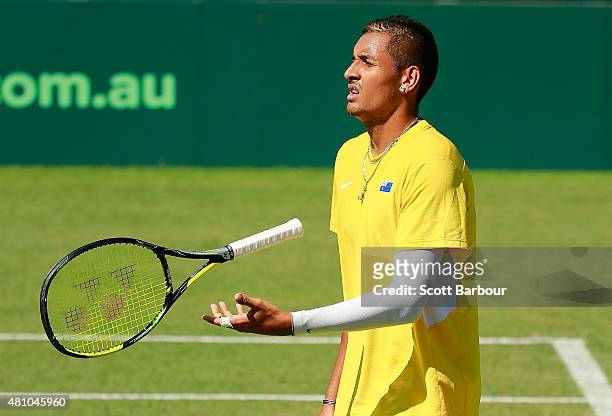 Nick Kyrgios of Australia throws his racquet as he loses a game against Aleksandr Nedovyesov of Kazakhstan during day one of the Davis Cup World...