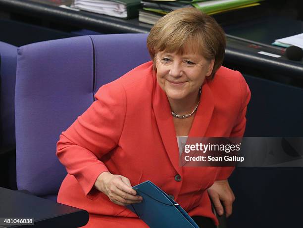 German Chancellor Angela Merkel prepares to speak during debates prior to a vote over the third EU financial aid package to Greece at an...
