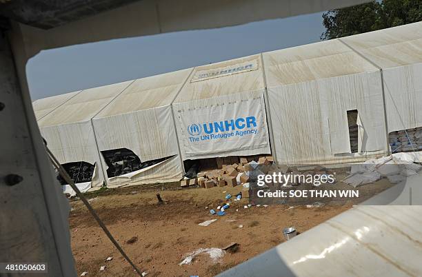 Damaged UNHCR warehouse in scene in Sittwe, Rakhine state western Myanmar on March 28, 2014. An 11-year-old girl was accidentally killed when Myanmar...