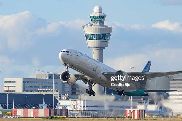 airplane taking off from schiphol airport in holland - garuda indonesia stock pictures, royalty-free photos & images