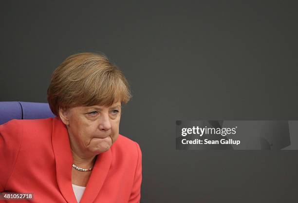 German Chancellor Angela Merkel attends debates prior to a vote over the third EU financial aid package to Greece at an extraordinary session of the...