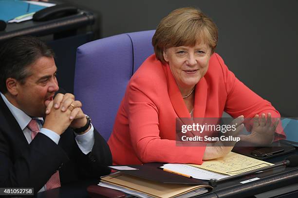 German Chancellor Angela Merkel and Vice Chancellor and Economy and Energy Minister Sigmar Gabriel attend debates prior to a vote over the third EU...