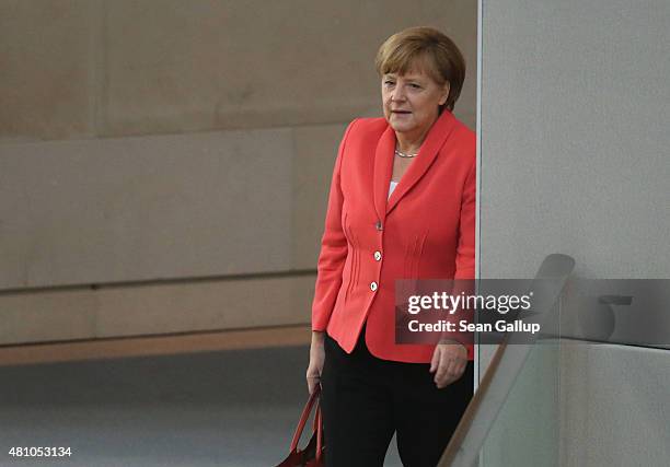 German Chancellor Angela Merkel arrives to attend debates prior to a vote over the third EU financial aid package to Greece at an extraordinary...
