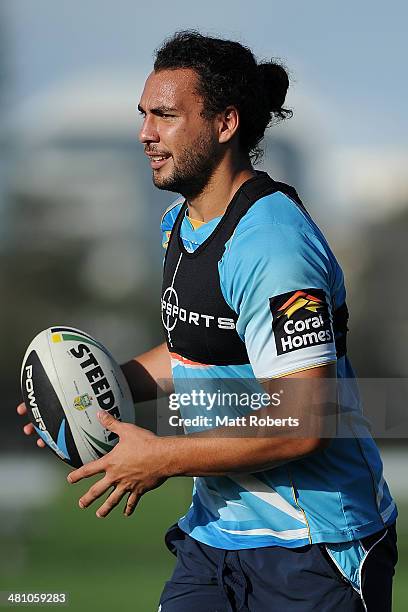 Ryan James looks to pass the ball during a Gold Coast Titans NRL training session at Tugun Rugby League Field on March 28, 2014 on the Gold Coast,...