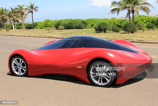 Twenty-seven-year auto enthusiast Chen Yinxi tests drive his self-made electric SportsCar at square of Hainan International Convention And Exhibition...