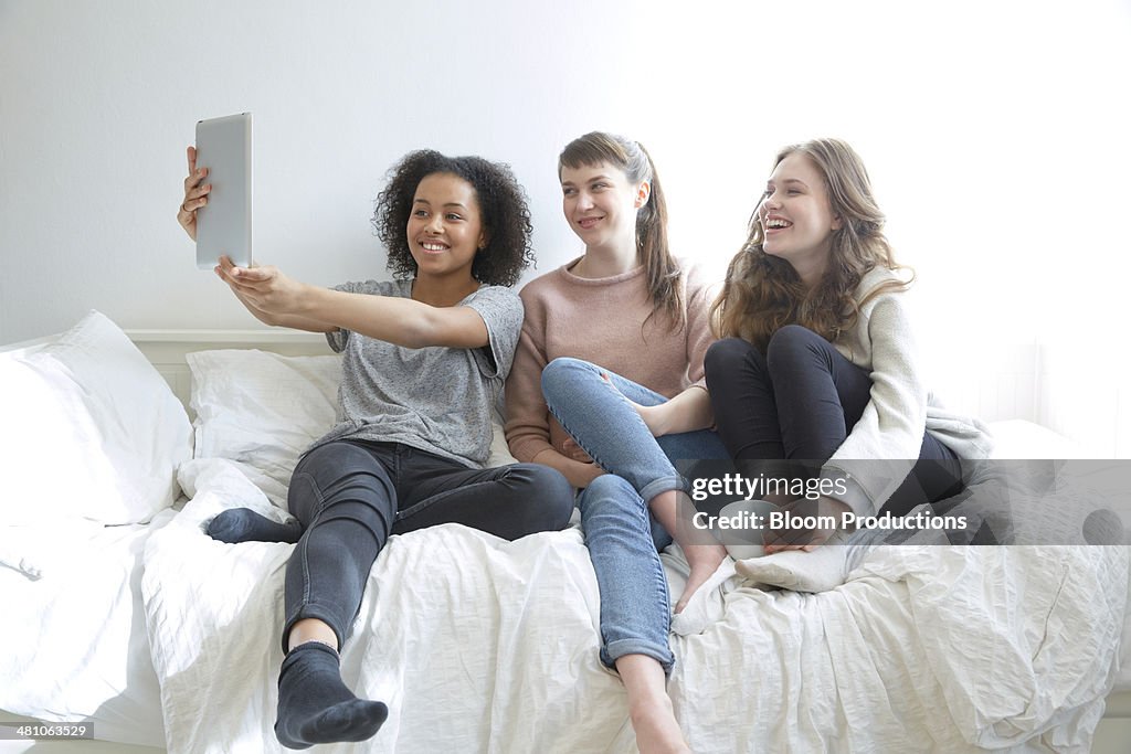 Teenage girls taking a selfie photograph