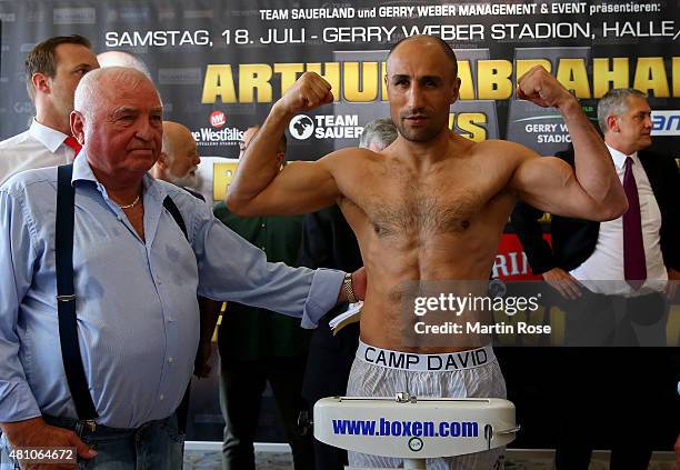 Super middleweight fighter Arthur Abraham of Germany poses during the weigh in at the Orth & Nagel Autohaus on July 17, 2015 in Halle, Germany.