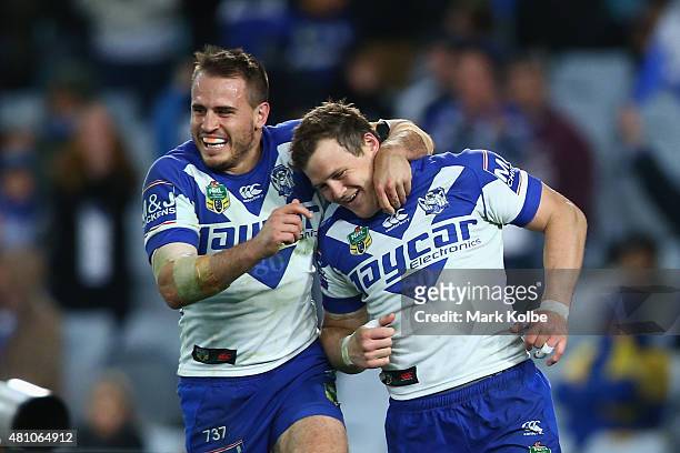 Josh Reynolds and Brett Morris of the Bulldogs celebrate after Morris scored a try during the round 19 NRL match between the Parramatta Eels and the...