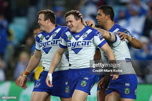 Josh Morris, Brett Morris Josh Reynolds and Curtis Rona of the Bulldogs celebrate after Brett Morris scored a try during the round 19 NRL match...