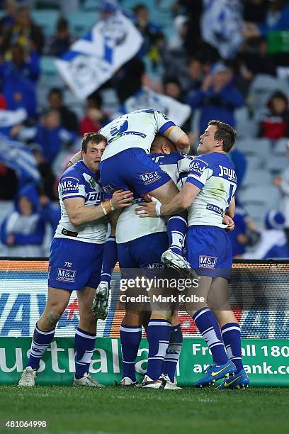 The Bulldogs celebrate after Josh Jackson of the Bulldogs scoed a try during the round 19 NRL match between the Parramatta Eels and the Canterbury...