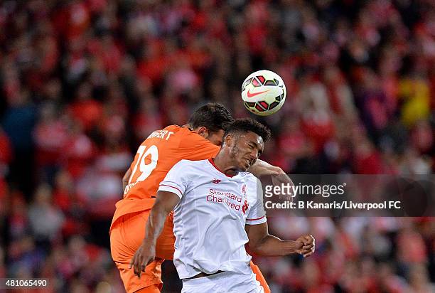 Joe Gomez of Liverpool and Jack Hingert of the Roar compete for the ball during the international friendly match between Brisbane Roar and Liverpool...