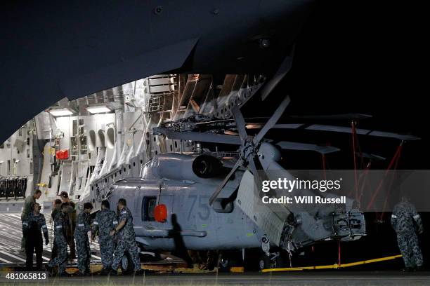 Navy Seahawk helicopter is offloaded from a RAAF C17 Globemaster aircraft at the RAAF base in Bullsbrook on March 28, 2014 in Perth, Australia. The...