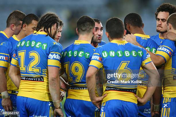 Tim Mannah of the Eels speaks to his players in a huddle after defeat during the round 19 NRL match between the Parramatta Eels and the Canterbury...