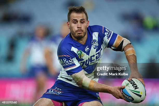 Josh Reynolds of the Bulldogs passes during the round 19 NRL match between the Parramatta Eels and the Canterbury Bulldogs at ANZ Stadium on July 17,...