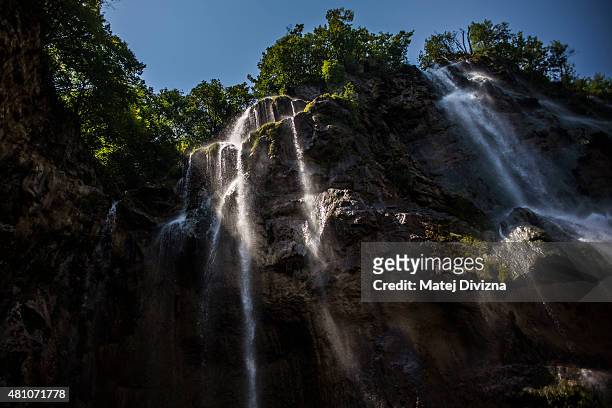 Water falls down from the Big Waterfall at Plitvice Lakes National Park on July 6, 2015 near Plitvicka Jezera, Croatia. Plitvice Lakes National Park...