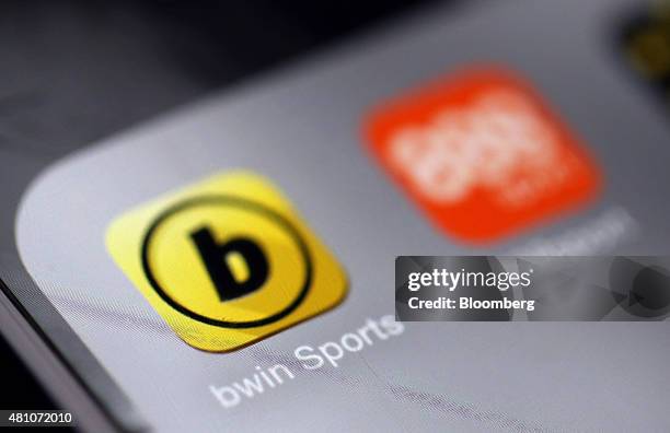 The Bwin.party Digital Entertainment Plc sports betting app, left, and the 888 Holdings Plc sports betting app sit on a smartphone device in this...