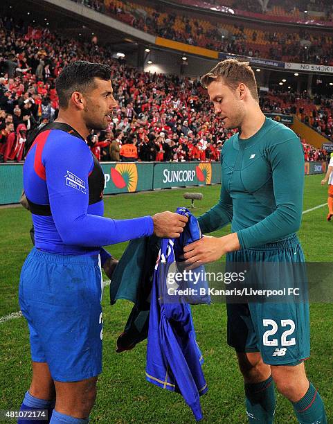 Goalkeepers Simon Mignolet of Liverpool and Jamie Young of the Roar swap jerseys after the international friendly match between Brisbane Roar and...