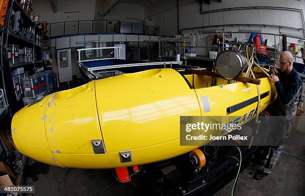 Technician at the GEOMAR Helmholtz Center for Ocean Research preforms maintenance work on the "Abyss" deep-sea autonomous underwater vehicle on March...