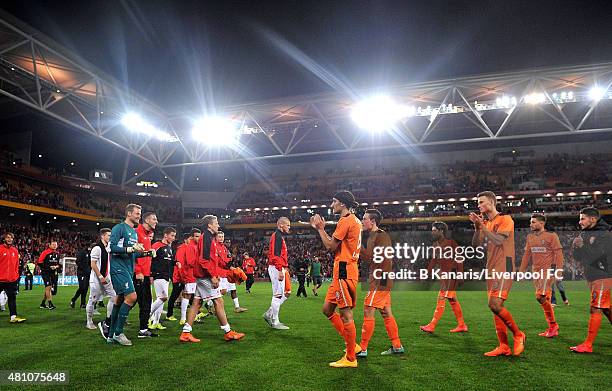 Both teams do a lap of the ground to thank the fans during the international friendly match between Brisbane Roar and Liverpool FC at Suncorp Stadium...