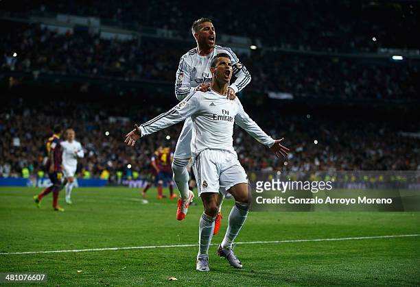 Cristiano Ronaldo of Real Madrid celebrates his team's third goal with Sergio Ramos of Real Madrid during the La Liga match between Real Madrid CF...