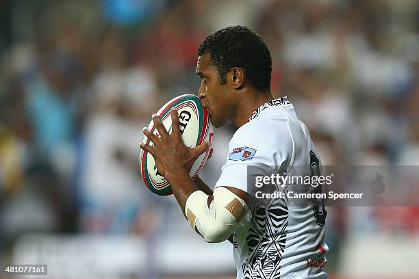 Samisoni Viriviri of Fiji celebrates scoring a try during the Pool A match between Fiji and Wales during day one of the 2014 Hong Kong Sevens at Hong...