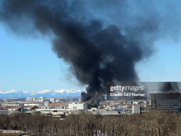 iko plant in flames - environmental damage stock pictures, royalty-free photos & images