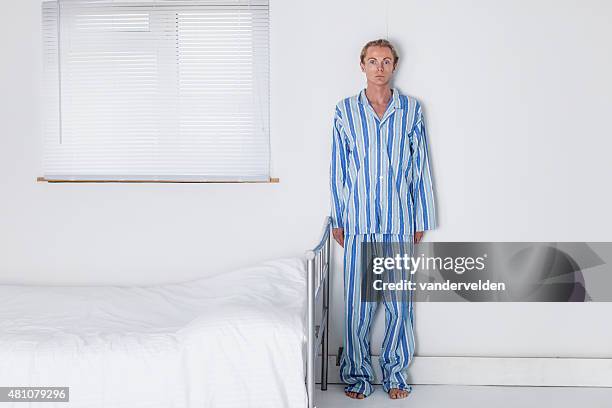 old fashioned man in his stark bedroom - striped pajamas stock pictures, royalty-free photos & images