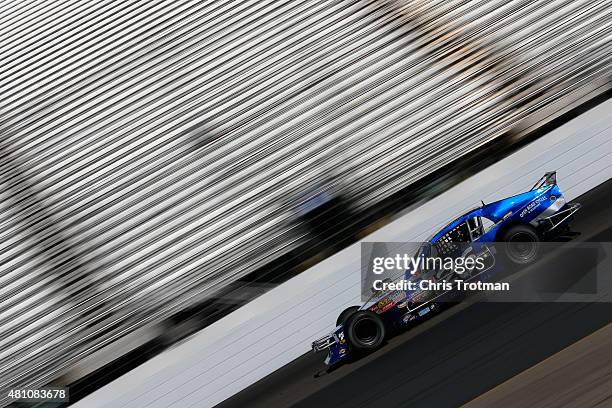 Gary McDonald, driver of the Lakeland Landscape/TRC Electric Pontiac, practices for the NASCAR Whelen Modified Tour Andy Blacksmith 100 presented by...